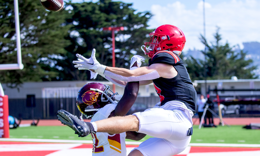 Max Rodarte goes up for an amazing TD grab against Sacramento City. (Photo by Eric Sun)