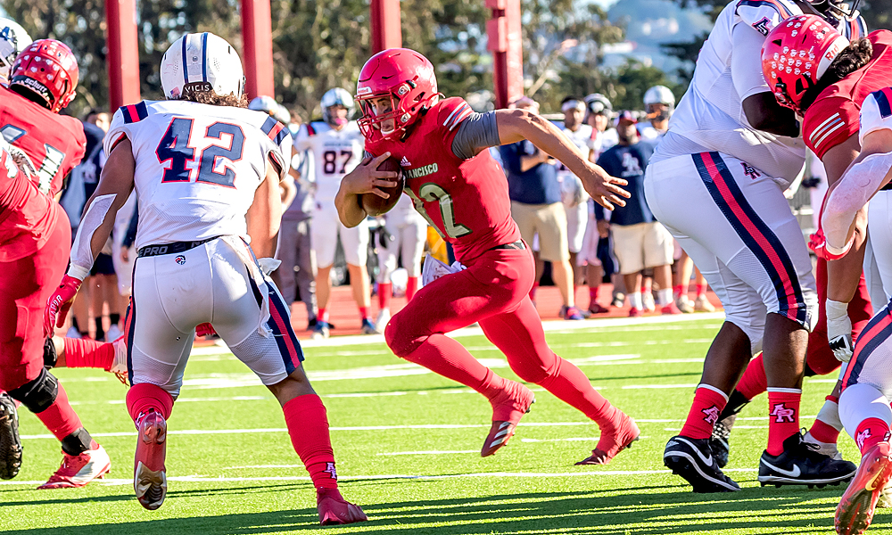 CCSF quarterback Jack Newman ran for a pair of TDs in the Rams' playoff win over American River. (Photo by Eric Sun)